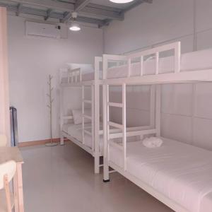 Postel nebo postele na pokoji v ubytování Convenient Resort