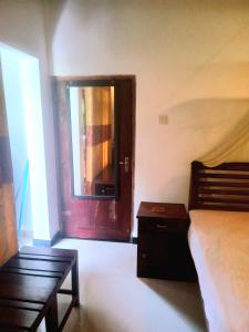 Ένα ή περισσότερα κρεβάτια σε δωμάτιο στο Mahagedara