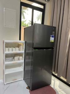 Kuchyň nebo kuchyňský kout v ubytování Mia Apartelle