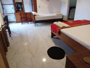Ένα ή περισσότερα κρεβάτια σε δωμάτιο στο Mahagedara
