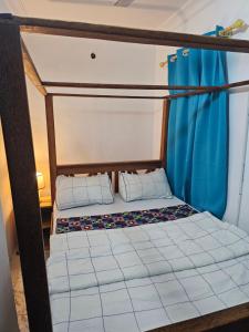 a bunk bed with two pillows on top of it at Jacob's Inn in Zanzibar City