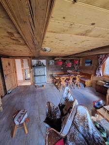 an overhead view of a room with chairs and tables at Appartement Valaisan typique in Guttet-Feschel +14 photos