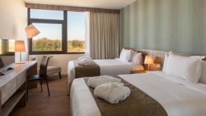 Postel nebo postele na pokoji v ubytování Salinas del Almiron Resort Termal