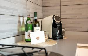 Příslušenství pro přípravu čaje a kávy v ubytování Casa Nizza D'Oro