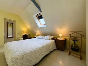 a bedroom with a large bed and a window at Chez castagnet in Assat