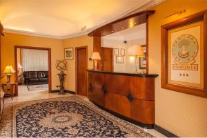 Posteľ alebo postele v izbe v ubytovaní Hotel Piemonte