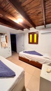 Postel nebo postele na pokoji v ubytování Beit Wanasa hotel apartments + 44 fotografií