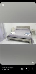 a picture of a bed in a room at Sea House in Torre del Greco +9 photos