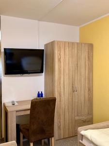 TV a/nebo společenská místnost v ubytování Hotel La-Pergola