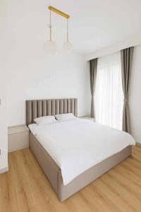 Ένα ή περισσότερα κρεβάτια σε δωμάτιο στο Downtown Panorama 9th Floor +6 φωτογραφίες