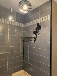 Koupelna v ubytování Petit studio attenant à la maison + 7 fotografií