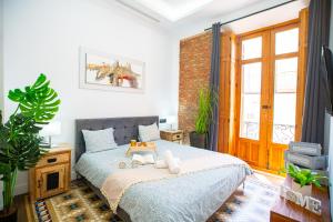 Ένα ή περισσότερα κρεβάτια σε δωμάτιο στο High-End Constitution Plaza Apartment - Malaga Center