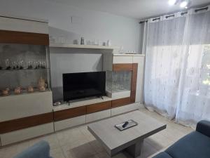 TV a/nebo společenská místnost v ubytování Apartamento en Sueños de Denia III muy cerca de la playa y del pueblo