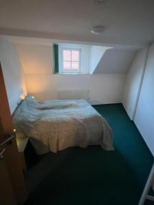 Postel nebo postele na pokoji v ubytování Ferienwohnung an der Kirchruine