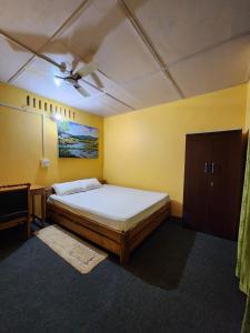 Ένα ή περισσότερα κρεβάτια σε δωμάτιο στο The Naturalist's Hideaway