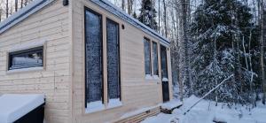 a cabin in the woods in the snow at Willa Haukilahti in Rovaniemi +9 photos