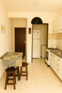 Η κουζίνα ή μικρή κουζίνα στο Vista deslumbrante do Santinho!