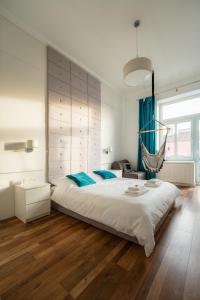 En eller flere senge i et værelse på Apartment by Cathedral