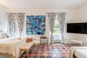 Postel nebo postele na pokoji v ubytování Palazzo Dasso