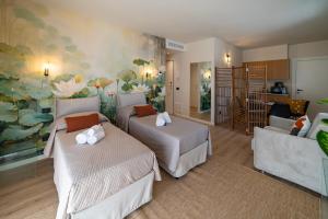 Postel nebo postele na pokoji v ubytování Urban Lodge- Appartamenti in Franciacorta