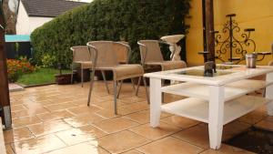a group of chairs and a table on a patio at A&S FerienwohnungenBonner str 49 in Bonn