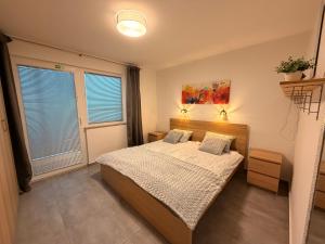 Postel nebo postele na pokoji v ubytování Apartma Rebolj