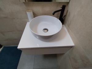 a white sink on a white counter in a bathroom at Le Côte d'Azur in Toulon