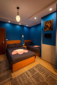 Ένα ή περισσότερα κρεβάτια σε δωμάτιο στο ImhOtep pYramids hOtel