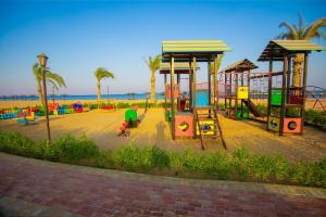a playground on the beach next to the ocean at La Cabana Beach Hotel Ain Sokhna in Ain Sokhna +17 photos