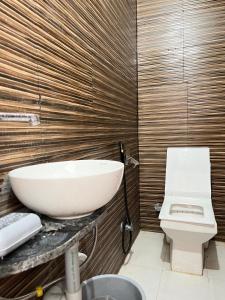 a bathroom with a sink and a toilet at Hotel haritage desert safari in Jaisalmer