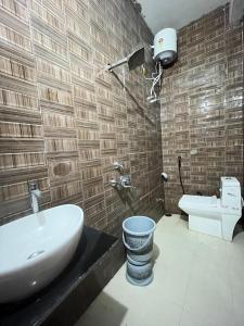 a bathroom with a sink and a toilet at Hotel haritage desert safari in Jaisalmer