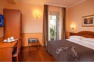 Posteľ alebo postele v izbe v ubytovaní Hotel Piemonte