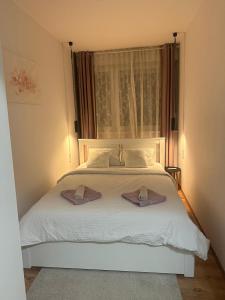 Ένα ή περισσότερα κρεβάτια σε δωμάτιο στο Apartman Emy