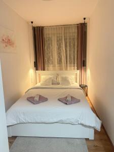 Ένα ή περισσότερα κρεβάτια σε δωμάτιο στο Apartman Emy