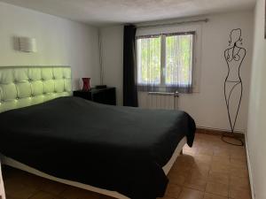 Postel nebo postele na pokoji v ubytování Le rez-de-jardin de SoPat + 13 fotografií