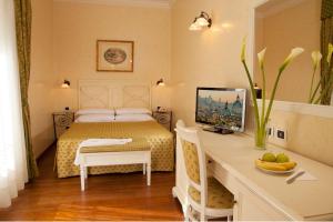 Posteľ alebo postele v izbe v ubytovaní Hotel Piemonte
