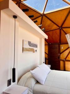 Ένα ή περισσότερα κρεβάτια σε δωμάτιο στο Secreto Sierras Domos Boutique con Jacuzzi y Desayuno +10 φωτογραφίες