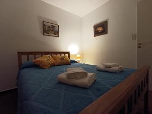 Postel nebo postele na pokoji v ubytování Microcentro Sanjuanino