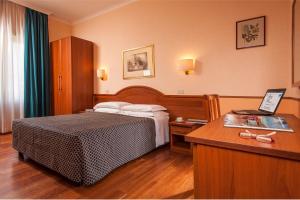 Posteľ alebo postele v izbe v ubytovaní Hotel Piemonte