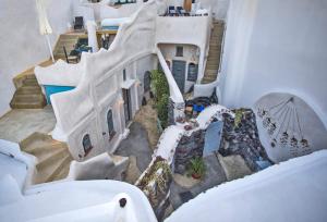 an aerial view of a house with a staircase at Αura Cave in Fira