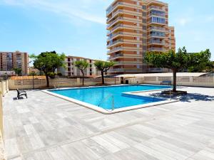 a swimming pool on the roof of a building at BeniforniaLove in Benicàssim
