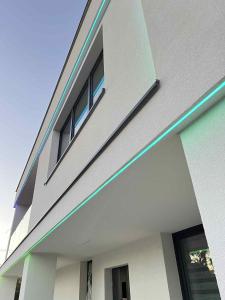 a building with two windows on the side of it at Apartament Lubicz Dolny in Lubicz