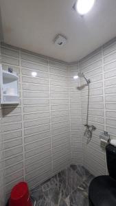 a bathroom with a shower and a toilet in it at Tayyurt Apartement city centre agadir in Agadir +18 photos