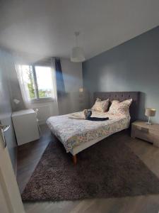 Ένα ή περισσότερα κρεβάτια σε δωμάτιο στο 3 chambres - Vaulx en Velin