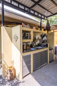 an outdoor kitchen with a counter in a house at Tamarindo Sunshine in Tamarindo +172 photos