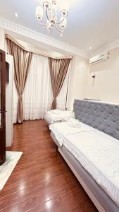 Postel nebo postele na pokoji v ubytování Ashur Bobo