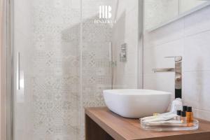 Ένα μπάνιο στο Binario 4 Rooms Suite