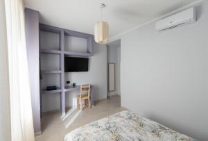 TV a/nebo společenská místnost v ubytování Bergamo Luxury apartment - Orange Blossom