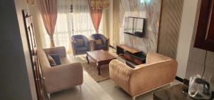 Posezení v ubytování Cozy 2br Apt Bukoto kisasi near all Amenities