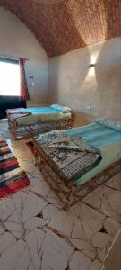 Ένα ή περισσότερα κρεβάτια σε δωμάτιο στο Nile Domes Guest House